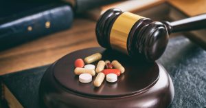 law gavel and colorful pills