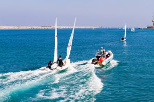 unexpected sailing accident of two towed speeding beginners laser boats